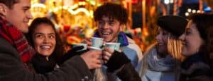 -Group-Of-Friends-Drinking-Mulled-Wine