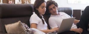 students on sofa searching for student accommodation