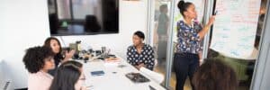 Woman-Presenting-Revision-Notes-To-Others