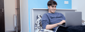 student checking the #AtHomeWithHost campaign online